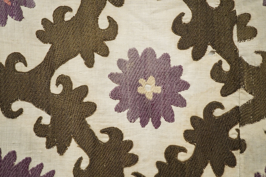 A late 19th early 20th century Uzbekistan (possibly Samarkand) embroidered Suzani. Made from hand loomed linen, pieced together then hand embroidered with large decorative sun or moon motifs as a large table cover or han